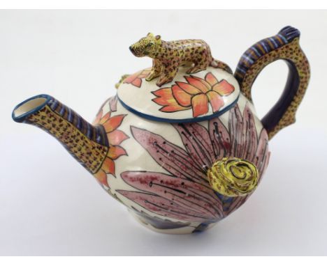 A South African Paulinah decorative teapot painted by Zinhle Ardmore Art, hand-painted with jungle scenes of palm trees and l