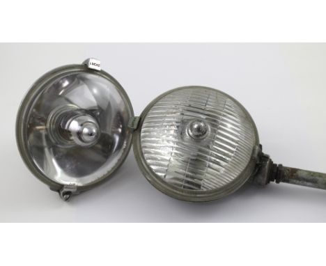 A vintage Lucas WOR576 chrome-backed clear glass head lamp and a Lucas SFT5765 chrome-backed head lamp adapted as a hand lamp