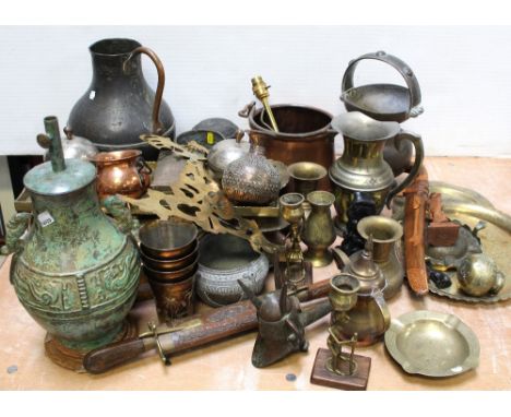 A quantity of Eastern and Oriental metalware to include a large metal picture, various pots and boxes in brass, a pot with mi