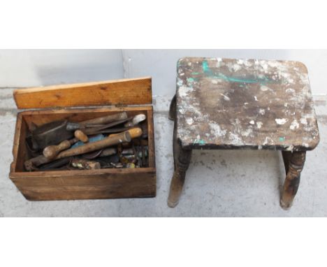 A collection of vintage tools to include pliers, screwdrivers, hand drill, hammer, spring balance scales etc and a four-legge
