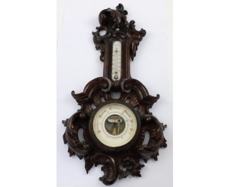 A small Victorian walnut barometer/thermometer in the Rococo style, height 49cm.