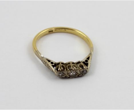 An 18ct gold ladies' dress ring with three illusion set diamonds, size Q, approx 3.6g.