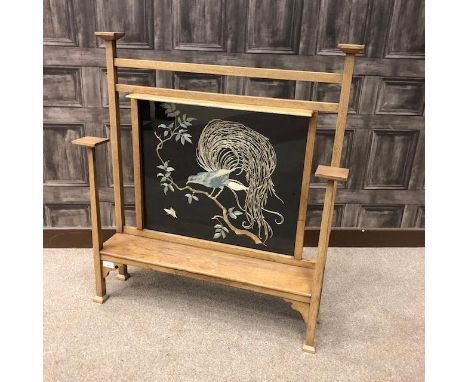 GLASGOW SCHOOL OAK FIRESCREEN, inset with needlework panel depicting an exotic bird and butterfly, above an outset ledge and 