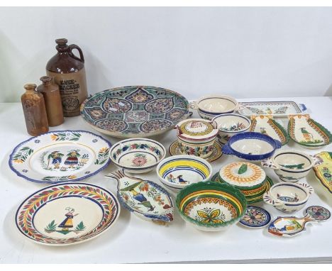 A mixed lot to include a Moroccan ceramic charger, together with Quimper ware and stoneware bottles Location: 