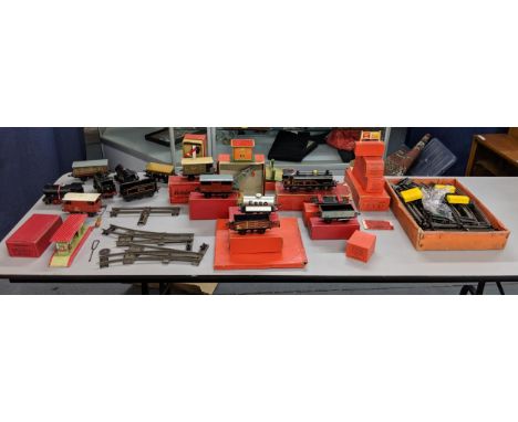 A collection of boxed and loose Hornby O gauge to include several engines, tracks, carriages and accessoriesLocation: 