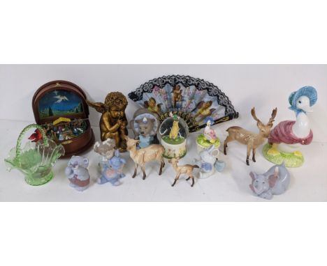 A mixed lot to include a Danbury Mint Nativity music box, Nao figures, Beswick deer, and others Location: 