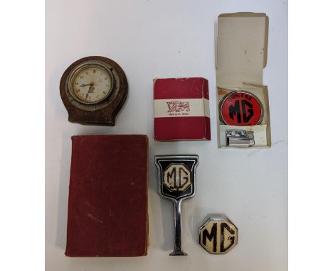 M G related items to include a workshop manual 1955, three badge and Smith clock, Location:A2M 