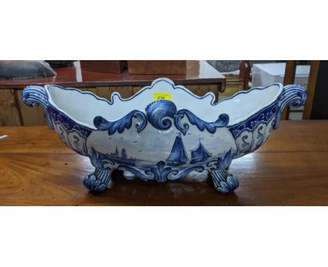 A French Masonic delft style blue and white pottery planter decorated with a scene of sail boats on a river, twin scrolled en