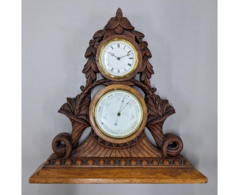 A late Victorian oak carved mantel clock/barometer carved with cornucopias and flowers, on a plinth base 42cm h x 41cm w Loca