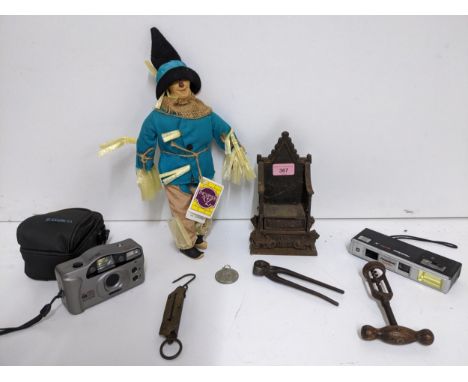 A mixed lot to include a Harper cast iron 1953 Coronation chair money box, wooden handled corkscrew with open barrel, The Wiz