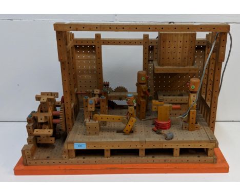 A self-made (possibly Mattel) woodworking/watermill workshop, with electrically-powered motor (this lot has no plug), and thr