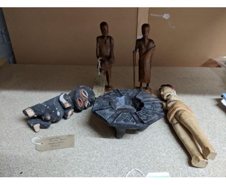 A group of African tribal art carved wooden figures and a bowl to include a painted light wood fetish doll with provenance ta