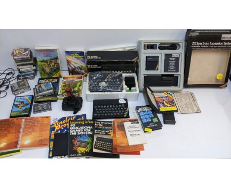 Vintage games console/computers to include two ZX Spectrums, an Expansion system, games, joy stick booklets and other itemsLo