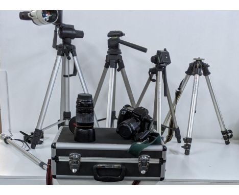 A Canon GR-70 with a Canon EW-63 lens and a Canon ET-65II and one other along with Four tripods Location: 