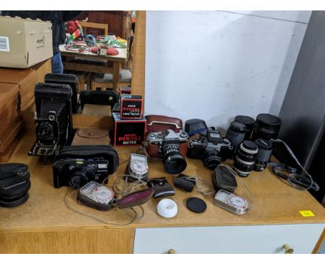 A collection of vintage film camera and digital cameras, accessories and equipment to include a Pentax S1a SLR with Pentax 50