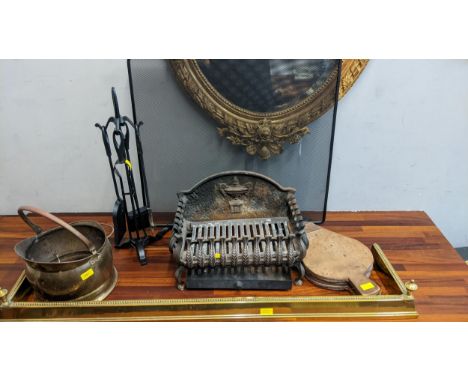 Fire related items to include a grate, companion set, a coal skuttle, a guard and bellowsLocation: 
