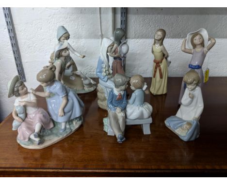 Nine china models, some by Nao and others by Lladro, to include a Nao model of a boy and girl on a bench, a Lladro figure of 