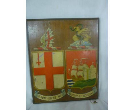 A rectangular polished wood panel decorated with twin coats of arms, 13" x 11"