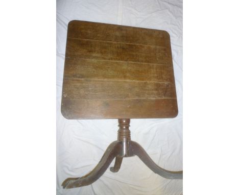 A 19th Century oak square tilt-top table on turned column with tripod base