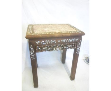 A Chinese mahogany rectangular plant table with inset pink marble rectangular top and inlaid mother of pearl floral decoratio