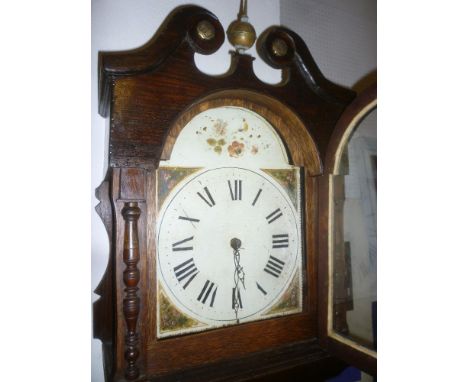 A 19th Century longcase clock with 12" painted arched dial and 30hour movement in oak traditional glazed case