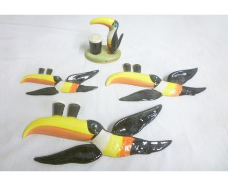 A set of three Carltonware china graduated Guinness Toucan wall plaques and a Carltonware Guinness Toucan figure "My Goodness