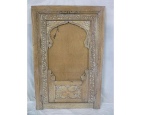 A large Middle Eastern carved sandalwood rectangular screen with central blank panel 61½" x 40"