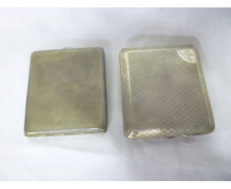 A George V silver rectangular cigarette case with engine turned decoration, London marks 1925 and one other silver rectangula