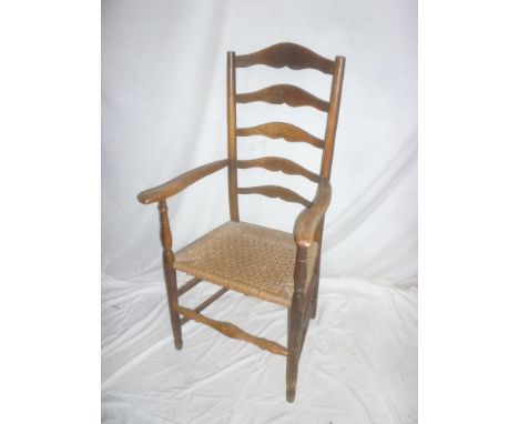 A 19th Century ash &amp; beech ladder back open arm carver chair with string work seat on turned supports