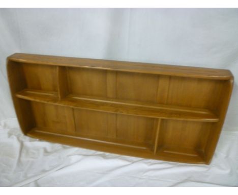 A 1960's Ercol light elm wall mounted open plate rack, 42" long