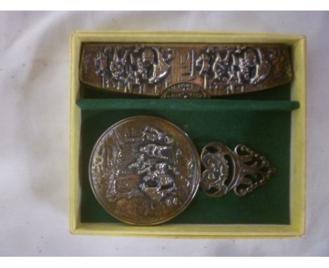 A Dutch silver child's hand mirror with raised figure and scroll decoration and matching silver-mounted comb, boxed