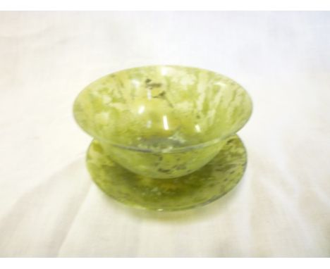 A Chinese jade circular tea bowl and stand 4" diameter 