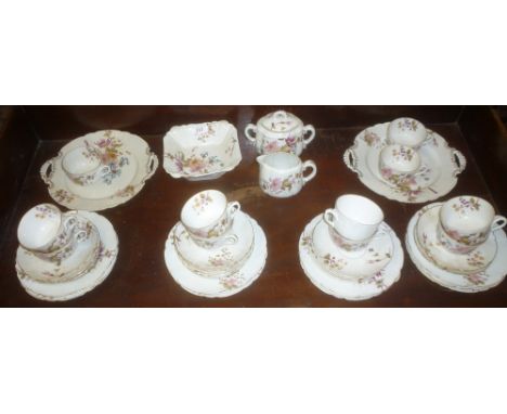 A 19th Century Continental china part-tea set with painted floral decoration comprising 12 teacups, 11 saucers, 12 tea plates