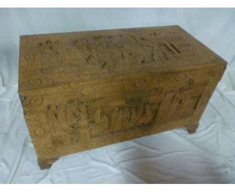 A good quality Eastern carved camphorwood rectangular trunk decorated with numerous character figures and landscapes