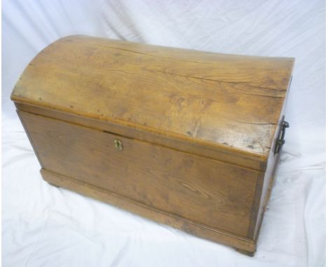 A 19th Century polished elm domed rectangular trunk with iron handles 