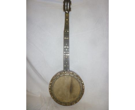An old rosewood banjo with mother of pearl inlay 