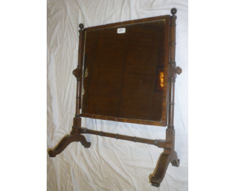A 19th Century mahogany square toilet mirror with bobbin turned supports
