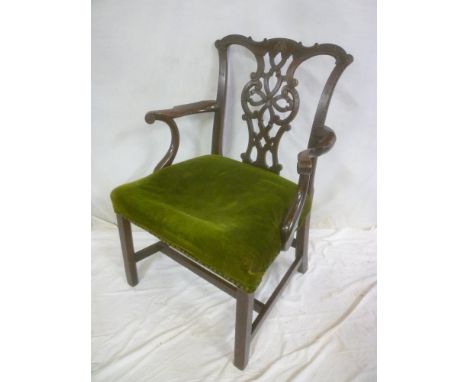 A late 18th /early 19th Century carved mahogany Chippendale style carver armchair with pierced vase, splat back &amp; upholst