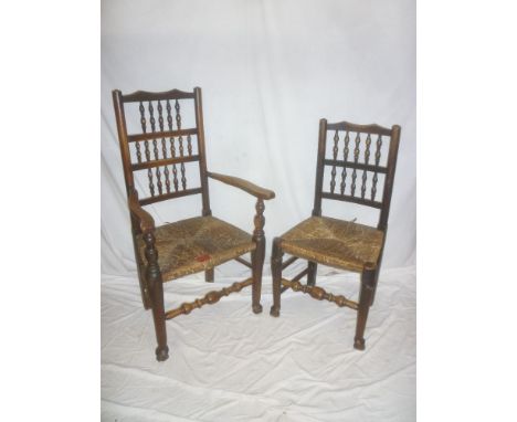 A set of five single and one carver early 19th Century Lancashire ash dining chairs with bobbin turned backs and rushwork sea