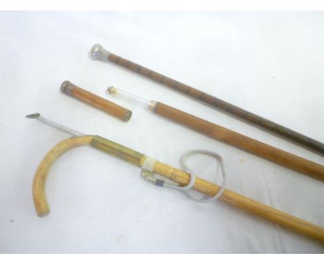 An old malucca tipplers walking stick with internal glass flask, horse measuring stick and a silver mounted walking cane (3) 