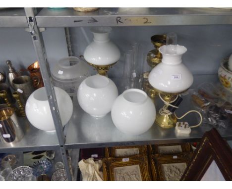 THREE TABLE OIL LAMPS CONVERTED FOR ELECTRICAL USE AND FOUR VARIOUS GLASS LAMP SHADES 