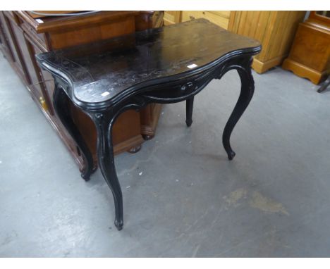 AN EBONISED FOLD-OVER CARD TABLE WITH OUT-SWEPT LEGS (A.F.) 