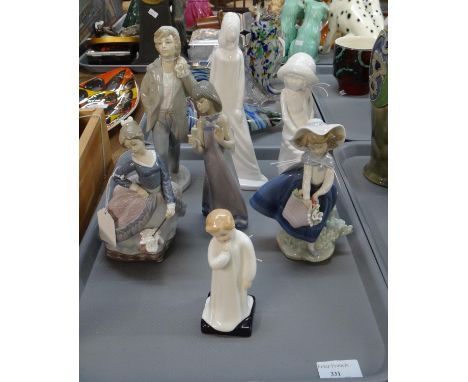 Tray of seven figurines to include: Spanish porcelain Lladro and Nao, Royal Doulton 'Darling' HN1985, Spode 'Joanna' and 'Geo