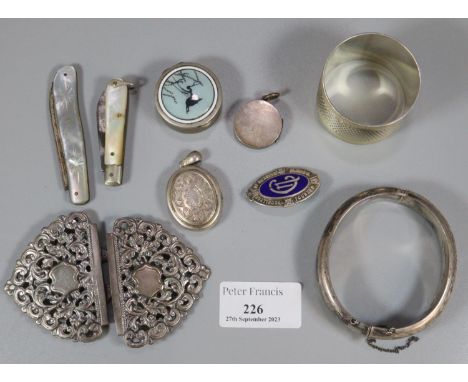 Bag of items to include: silver engine turned napkin ring, silver bangle, two mother of pearl and silver fruit knives, plated