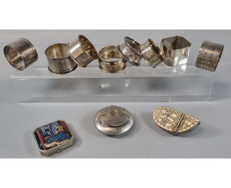 A collection of silver and plated napkin rings, together with tobacco/snuff box and another shell shaped snuff box and engine