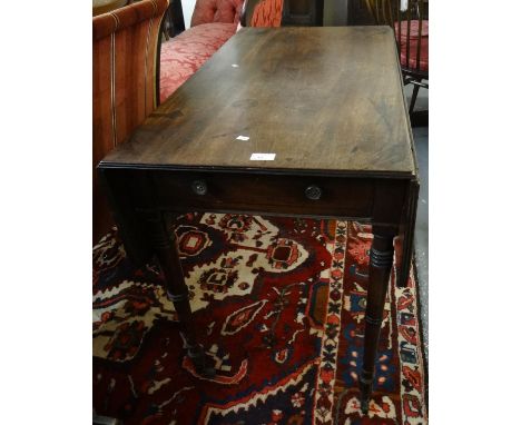 Victorian mahogany Pembroke table on ring turned tapering legs and brass casters.(B.P. 21% + VAT) 