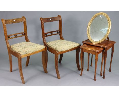 A gilt frame oval dressing table mirror with a beaded edge &amp; on an easel support, 18¼” high; together with a pair of rege