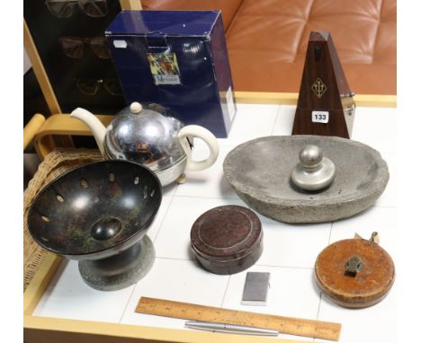 A modern metronome; a display of eleven pairs of glasses, in a glazed frame; a Chesterman’s vintage tape measure; &amp; sundr