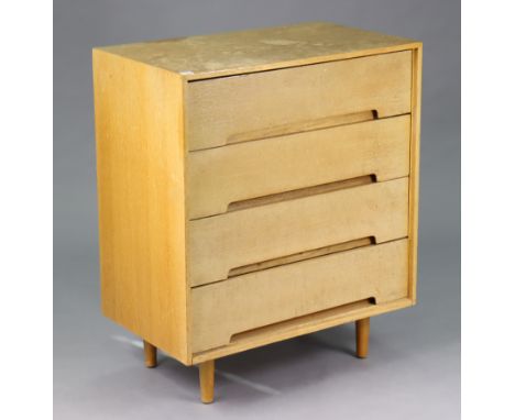 A Stag light oak small chest fitted four long drawers, &amp; on short rounded tapered legs, 29¾” wide x 36” high x 17¾” deep.