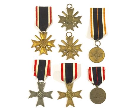 German Third Reich. 5 x 1939 War Merit Crosses, 2 x Medals. Three bronzed 2nd class examples with swords, two without swords 